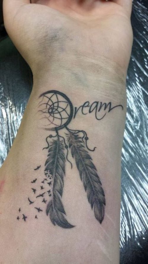 Grey Ink Small Dreamcatcher Tattoo On Left Wrist
